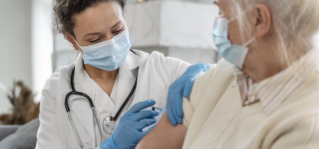 doctor_vaccinating_senior_woman